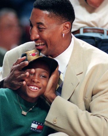 Antron Pippen's childhood photo with his father Scottie Pippen at basketball match.